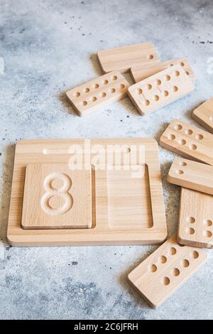 Wooden counting and writing trays - learning resource for educating littles on number writing, fine motor skills, hand eye coordination, mathematical Stock Photo