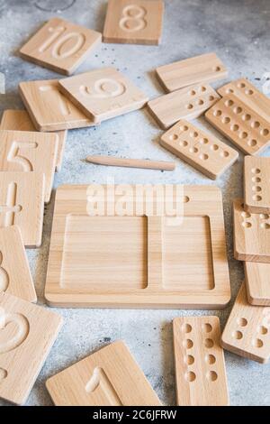 Wooden counting and writing trays - learning resource for educating littles on number writing, fine motor skills, hand eye coordination, mathematical Stock Photo