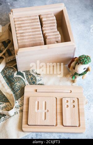 Wooden counting and writing trays - learning resource for educating littles on number writing, fine motor skills, hand eye coordination, mathematical Stock Photo