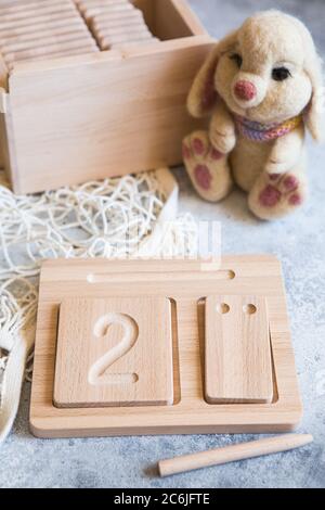 Wooden counting and writing trays - learning resource for educating littles on number writing, fine motor skills, hand eye coordination, mathematical Stock Photo