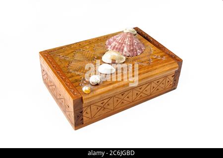 Vintage jewelry box isolated on white background. Wooden chest with seashells decoration on top Stock Photo