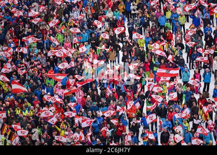 Austrian fans cheer ski jumpers  at the 2019 FIS World Nordic Championships, Seefeld, Austria. Stock Photo