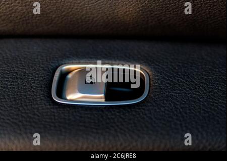 Close up black window lifter button in luxury car Stock Photo