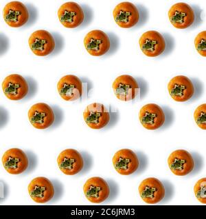 fresh ripe persimmons Tropical fruit seamless Pattern on white background Stock Photo