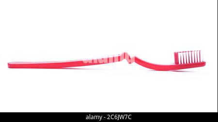 Red toothbrush isolated on white background. Stock Photo