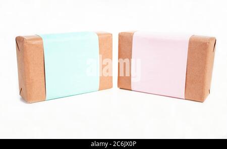 Two soap bars isolated on white background. Paper wrap packaging mockup. Elegant design Stock Photo