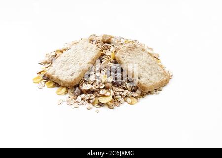 Mixture of oats,raisins and cookies on white background. Healthy breakfast meal Stock Photo
