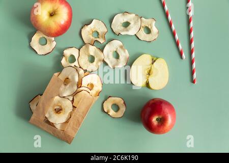 Diet chips made from dried apples. Dried fruits chips packaged in paper packaging. Dietary nutrition. Natural and healthy snack food. Stock Photo