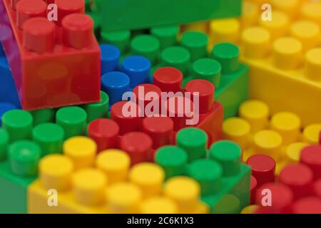 Many colorful plastic building blocks Stock Photo