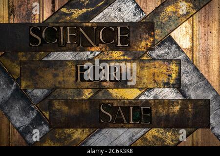Science for Sale text formed with real authentic typeset letters on vintage textured silver grunge copper and gold background Stock Photo