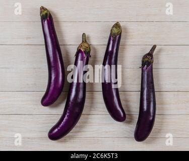 Japanese eggplant still life on a white wood background Stock Photo