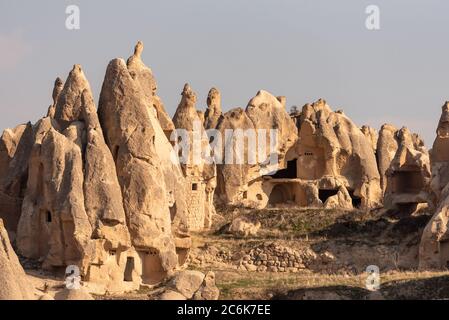 Houses built on the rocks of the Goreme Valley. Cappadocia, Turkey. Stock Photo