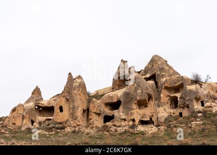 Houses built on the rocks of the Goreme Valley. Cappadocia, Turkey. Stock Photo