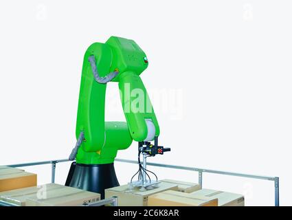 Robotic arms carriage the cardboard box for delivery in warehouse. Isolated on white background. Stock Photo