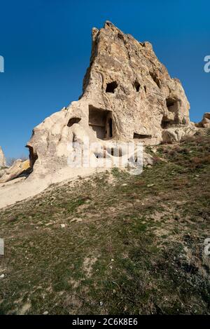 Houses built on the rocks of the Goreme Valley. Cappadocia, Turkey. Stock Photo