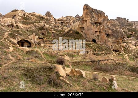 Houses built on the rocks of the Goreme Valley. Cappadocia, Turkey. Stock Photo