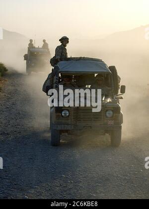 British Army Land Rover in Afghanistan with Soldiers Stock Photo
