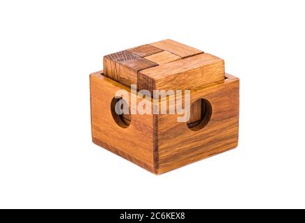 Wooden puzzle cube 7 in an open wooden container. Wooden puzzle isolated on white background. Stock Photo