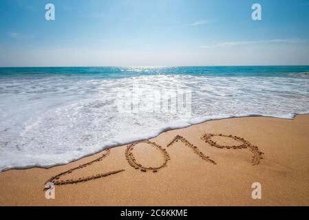 Old Year 2019 expires concept sandy tropical ocean beach lettering and Happy New Year 2020 is coming. Vacation at warm country concept image . Stock Photo