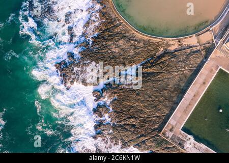 Aerial view of the Newcastle Ocean Baths and rugged coastline. Newcastle - NSW Australia Stock Photo
