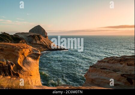 Cape Kiwanda illuminated by sunset, Pacific City, Oregon  Stock Photo