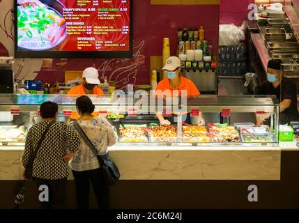 Toronto, Canada. 10th July, 2020. Customers order meals at a food court at CF Toronto Eaton Center in Toronto, Canada, on July 10, 2020. The economy added 953,000 jobs in Canada, and the jobless rate fell to 12.3 percent in June, as businesses reopened after the COVID-19 shutdown, according to Statistics Canada Friday. Credit: Zou Zheng/Xinhua/Alamy Live News Stock Photo