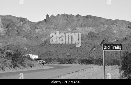 Ghost Town of Old Trails Sign on Route 66 in the Sonoran Desert, Arizona USA in Black and White Stock Photo