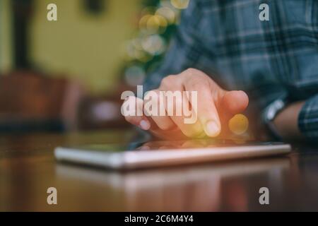 Woman hand using smartphone in cafe shop background. Business, financial, trade stock maket and social network concept. Stock Photo