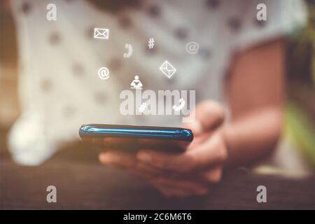 Communication fintech sign icon and connection screen of smartphone with blur cafe coffee shop background. Financial business technology freedom dream Stock Photo