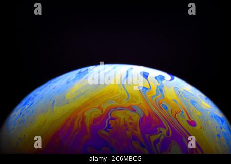 Light diffraction on soap bubble surface. Meteorological model. Stock Photo