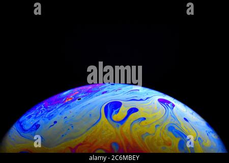 Light diffraction on soap bubble surface. Meteorological model. Stock Photo