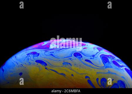 Light diffraction on soap bubble surface. Meteorological model. Stock Photo