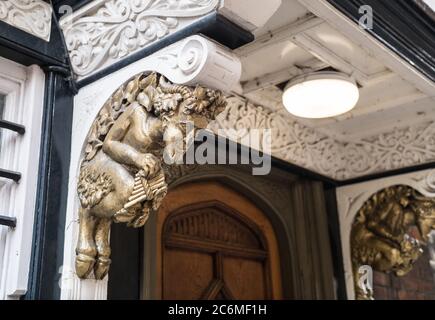 Faun that supposedely inspired C. S. Lewis for the Narnia character Mr. Tumnus. Door entrance. Located on St Mary's passage in Oxford, United Kingdom Stock Photo