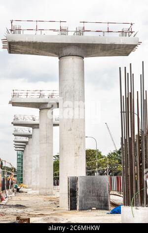 Construction of Mass Rail Transit column infrastructure in progress to improve transportation network Stock Photo