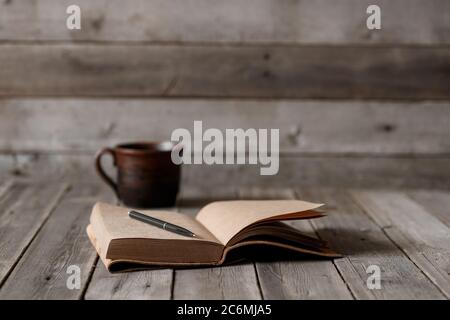 Office desk with blank screen smartphone,pen,notebook and coffee cup on wood table.Top view with copy space.Office supplies and gadgets on desk table.Working desk table concept.Flat lay image. Stock Photo