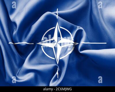 NATO flag texture creased and crumpled up with light and shadows Stock Photo