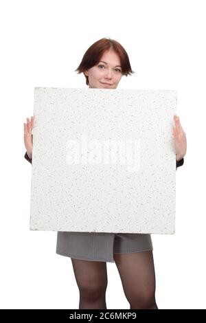 Studio portrait of a young woman on a white background isolated, holds the test space in his hands Stock Photo
