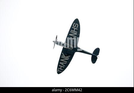 The NHS Spitfire plane does a flypast at Peterborough City Hospital, in appreciation of the work all NHS workers have done during the COVID-19 Coronavirus pandemic. Stock Photo