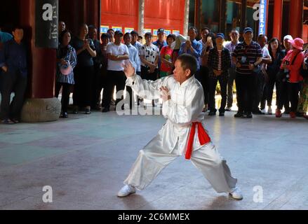 (200711) -- FUZHOU, July 11, 2020 (Xinhua) -- File photo shows a martial artist staging a performance at the Zheng Ancestral Hall in Puyuan Village, Puyuan Township, Zhouning County, southeast China's Fujian Province, June 16, 2019.  At the first glance, Puyuan Village appears no difference from other historical villages in China. But it's the carp fish in a local creek, known as the Carp Brook, that make the village special.     Puyuan village covers an area of 9.2 square kilometers and has a population of about 6,200. Originated from the Ziyun Mountain, several streams converge into the 3,00 Stock Photo