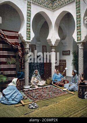 Moorish women making Arab carpets, Algiers, Algeria ca. 1899 Stock Photo