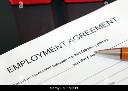 Symbol image: Blank form of an employment agreement on a desk Stock Photo