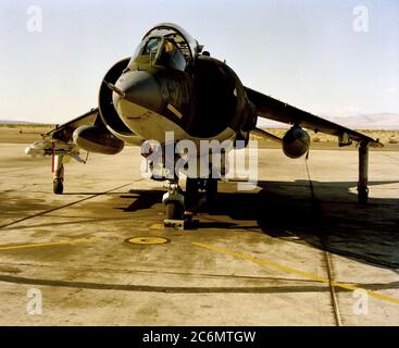 A front view of a Marine AV-8 Harrier aircraft with an AIM-9 Sidewinder missile mounted on the right wing. Stock Photo