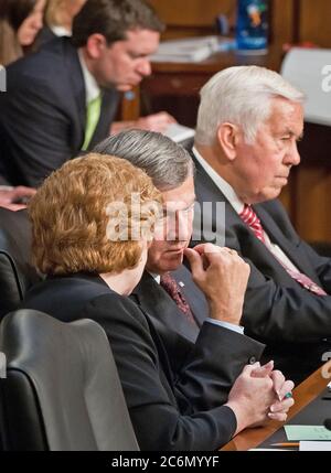 Senator Debbie Stabenow, MI, Chairwoman of the U.S. Senate Committee on Agriculture, Nutrition and Forestry and Senator and former Agriculture Secretary Mike Johanns, NE, discuss the proceedings during a hearing on the next Farm Bill with Agriculture Secretary Tom Vilsack in Washington, DC, Thur., May 26, 2011. Next to Senator Johanns is former Chairman Senator Richard Lugar, IN. Stock Photo