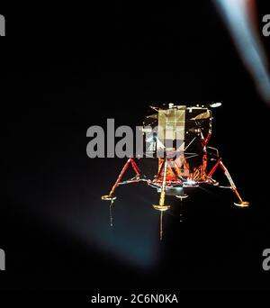 The Apollo 11 Lunar Module (LM), in a lunar landing configuration, is photographed in lunar orbit from the Command and Service Modules (CSM). Stock Photo