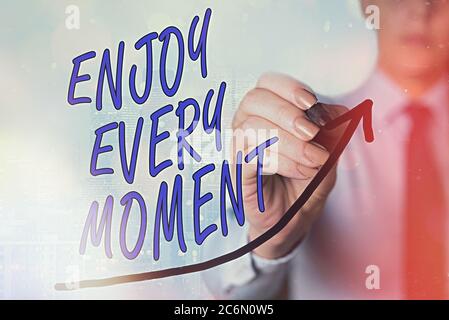 Writing note showing Enjoy Every Moment. Business concept for stay positive thinking for an individualal development Digital arrowhead curve denoting Stock Photo
