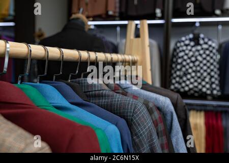 https://l450v.alamy.com/450v/2c6n15x/expensive-mens-clothing-store-a-row-of-jackets-on-hangers-shoping-sale-background-theme-clothes-on-hanger-in-shop-2c6n15x.jpg