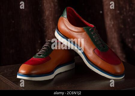 Elegant leather male shoes in the shop. expensive modern shoes for men Stock Photo