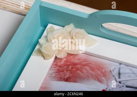 Roses with petals made of white polymer clay. Glue and brush. Crafts from  polymer clay Stock Photo - Alamy