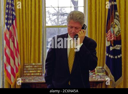 3/20/1998 - President William J. Clinton talking on the telephone with Governor Zell Miller of Georgia Stock Photo