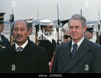 1978 - Egyptian President Anwar el-Sadat (left) receives military honors upon his arrival in the United States.  He is accompanied by US Secretary of State Cyrus R. Vance (right). Stock Photo